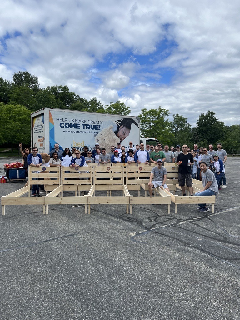 Employees Build Beds for those in need