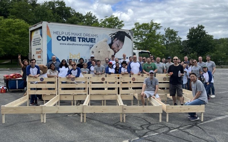 Employees Build Beds for those in need