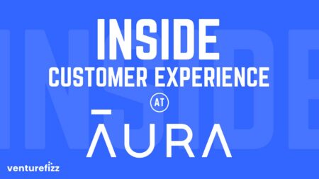 Blue banner with bold white text reading 'INSIDE CUSTOMER EXPERIENCE AT AURA' and VentureFizz logo in the bottom-left.