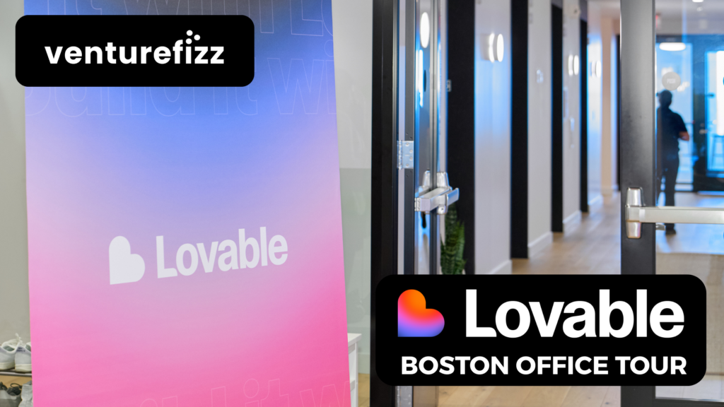 Vibrant Lovable banner beside a glass-door hallway, with a VentureFizz logo on a black rounded badge above left.