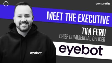 Portrait of Tim Fern, Chief Commercial Officer, smiling in a black hoodie with the eyobot logo, against a bold 'Meet the Executive' banner背景.